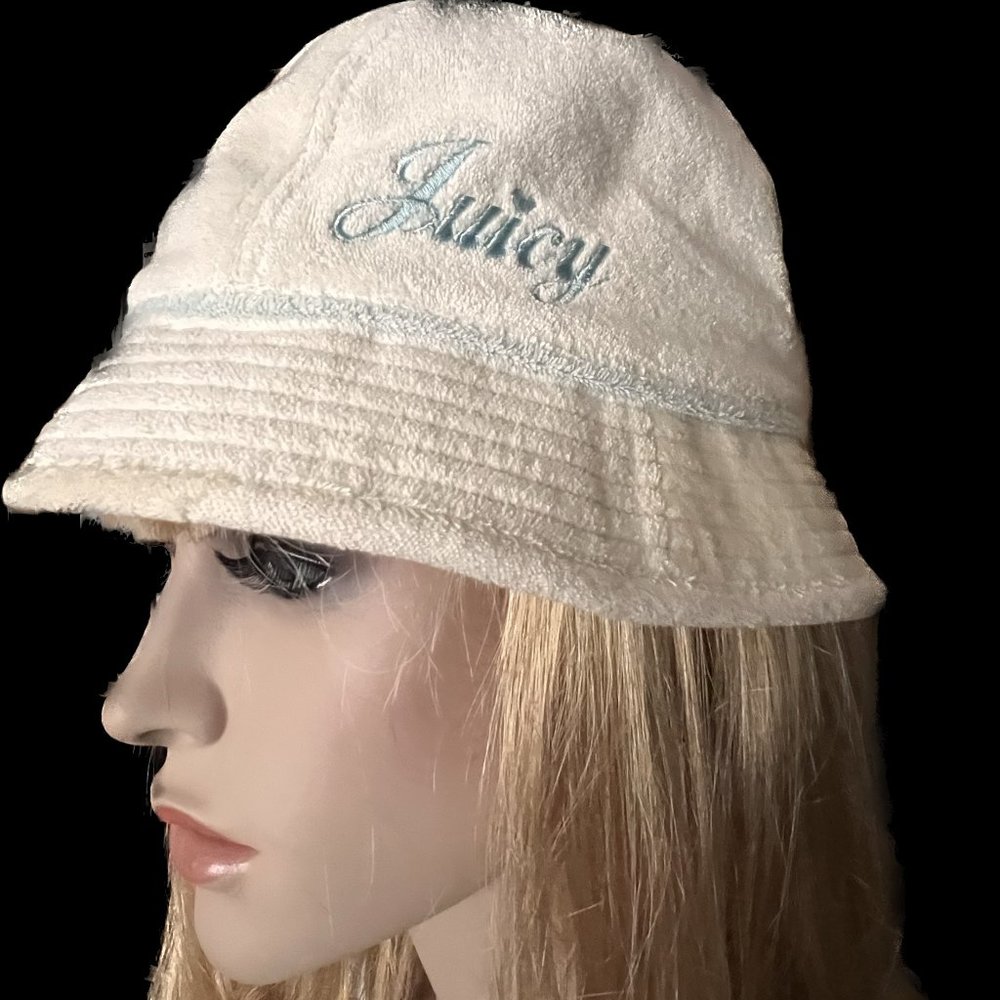 Juicy Couture beige terry hat with blue embroidery.
